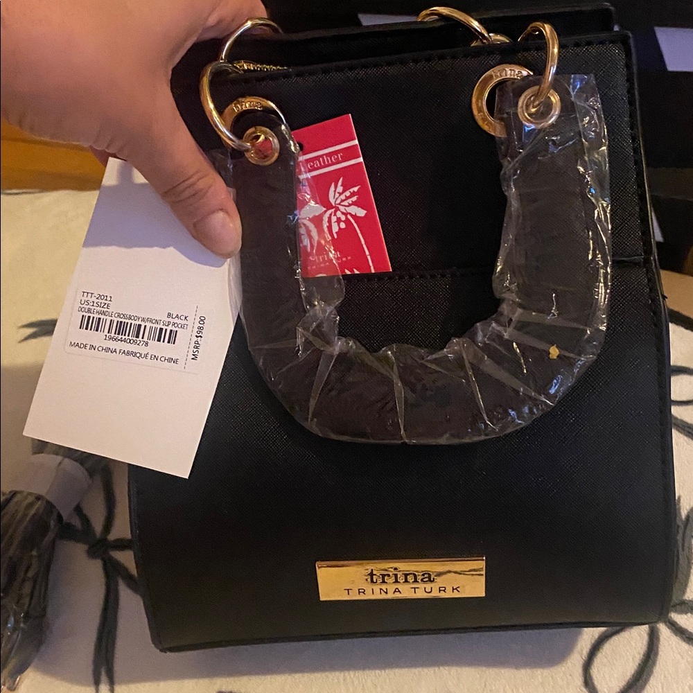 Trina Turk Black Tote with Gold Rings and detachable shoulder strap. NWT